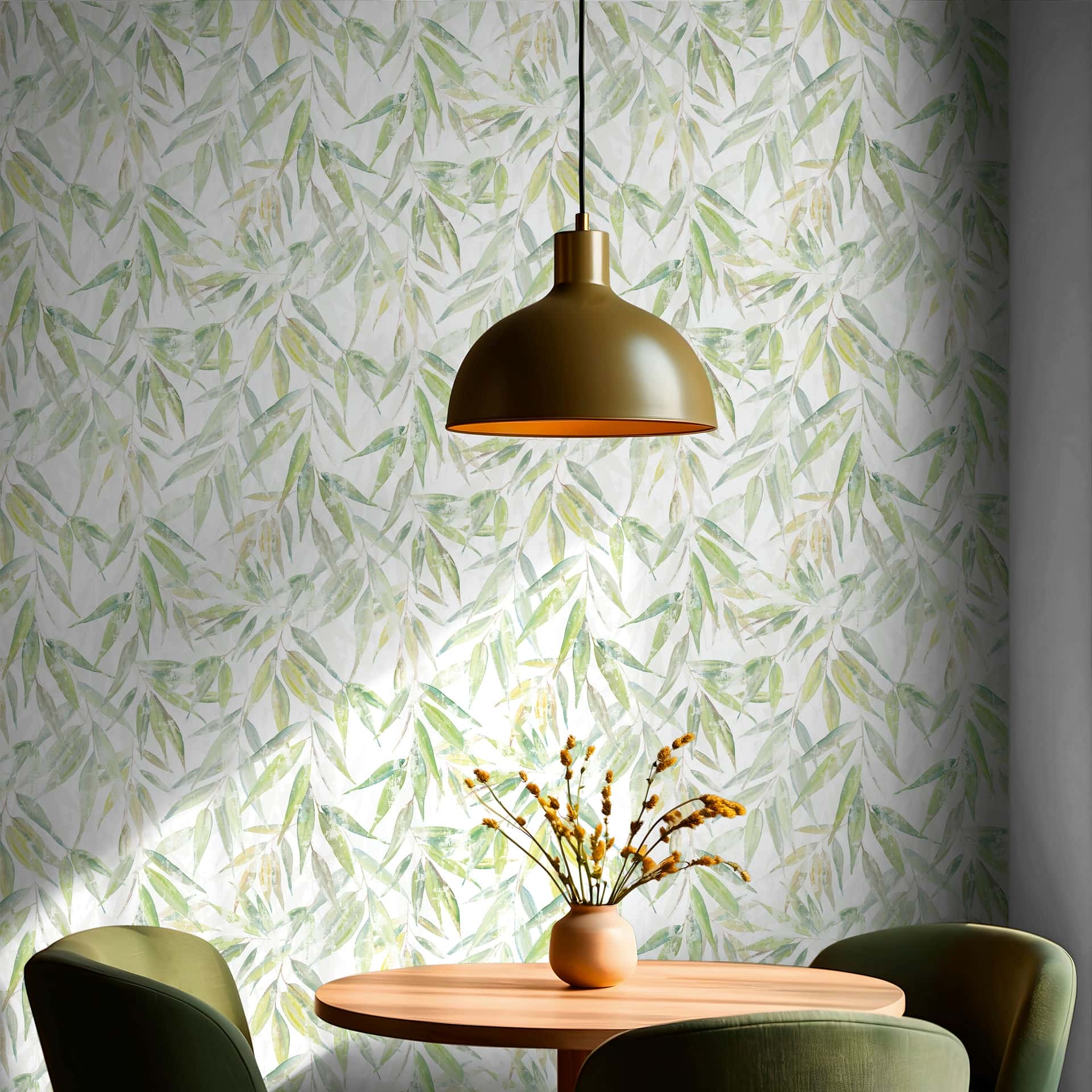 Marburg Naomi 89041 Green leaf pattern wallpaper on a white ground behind a round table with a vase and stems, two chairs, and a dome pendant light above.