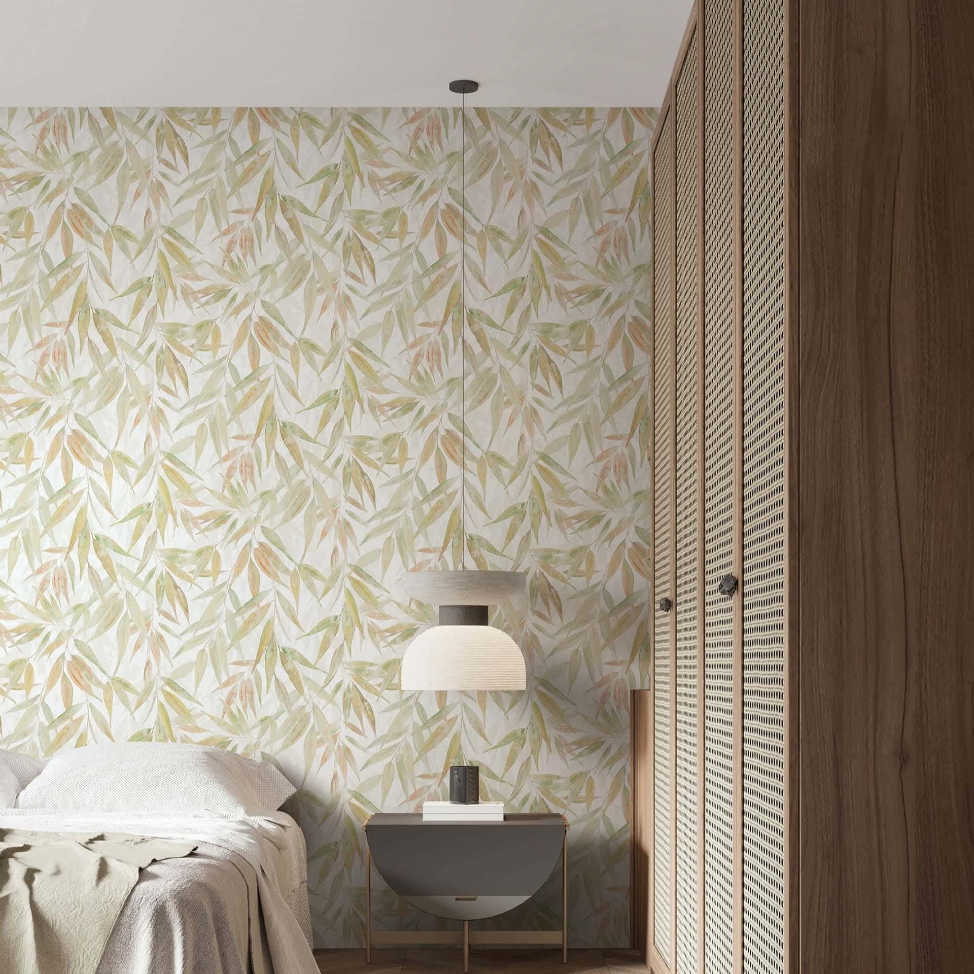 Marburg Naomi 89042 Botanical leaf pattern with layered, watercolor-style slender leaves in green and warm neutrals on a wallpaper on a bedroom feature wall.