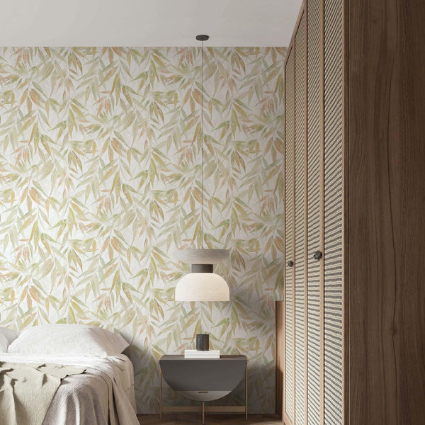 Marburg Naomi 89042 Botanical leaf pattern with layered, watercolor-style slender leaves in green and warm neutrals on a wallpaper on a bedroom feature wall.