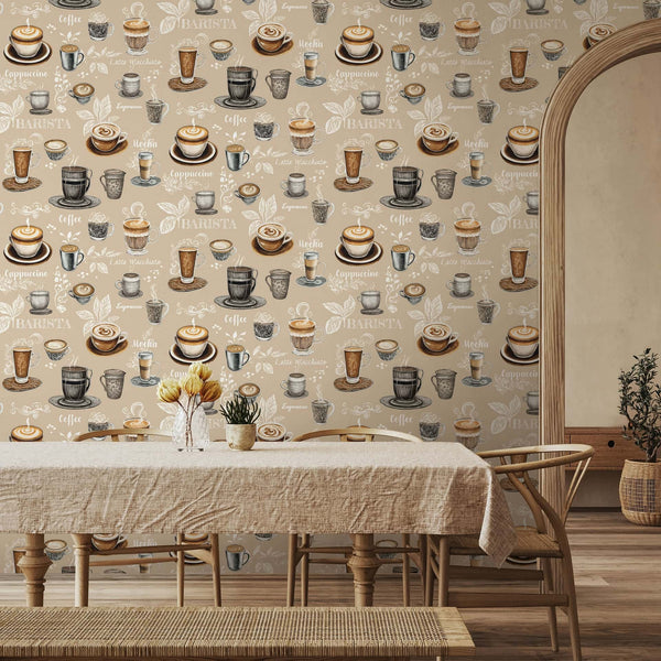 Marburg Naomi 89044 Beige wallpaper printed with coffee cups, mugs, and latte art along with scripted coffee names and leaf sketches, shown behind a dining table and chairs near an arched doorway.