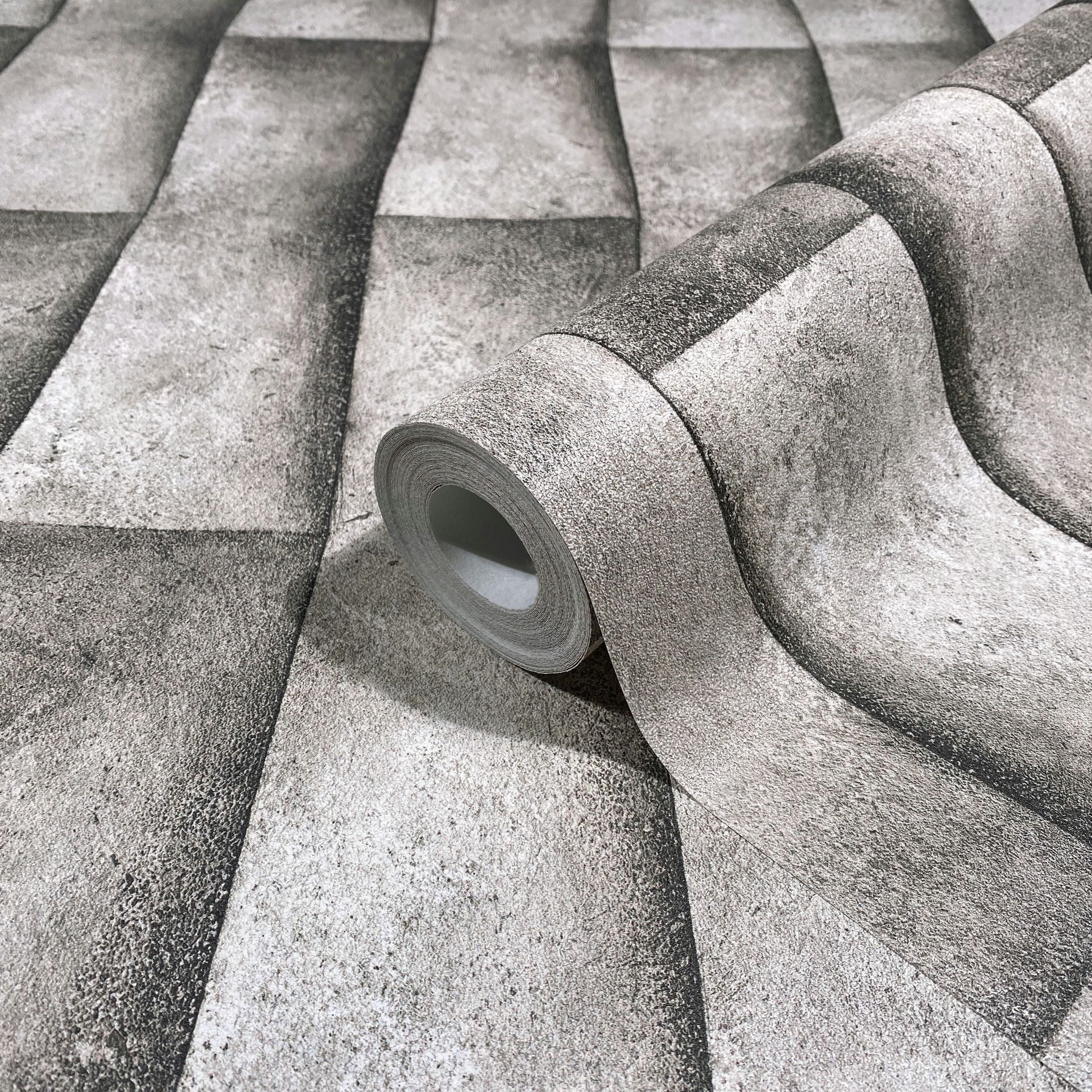 Marburg Novamur Mona 81650 Wallpaper roll shown on matching surface with a shaded rectangular block pattern that forms a 3D wavy effect in grey-beige tones.