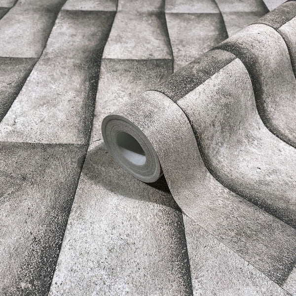 Marburg Novamur Mona 81650 Wallpaper roll shown on matching surface with a shaded rectangular block pattern that forms a 3D wavy effect in grey-beige tones.