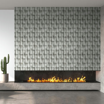 Marburg Novamur Mona 81651 Installed gray geometric 3D‑effect wallpaper shown as a feature panel above a long linear fireplace with visible flames; a potted cactus sits on the concrete hearth.