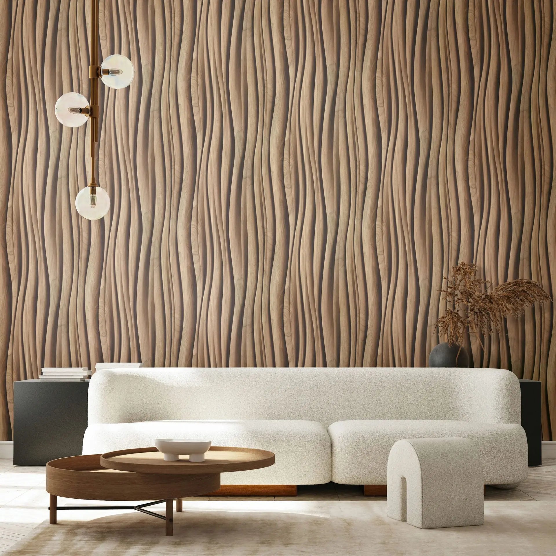 Marburg Novamur Mona 81667 Living room scene with a brown wavy vertical pattern wallpaper behind a curved white sofa, round wooden coffee table, a three-globe pendant light, and a dark vase with dried stems on a console.