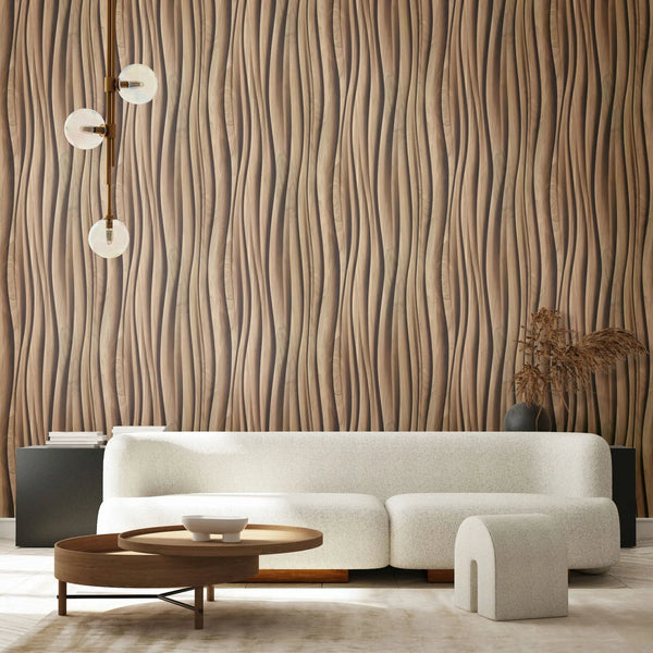 Marburg Novamur Mona 81667 Living room scene with a brown wavy vertical pattern wallpaper behind a curved white sofa, round wooden coffee table, a three-globe pendant light, and a dark vase with dried stems on a console.