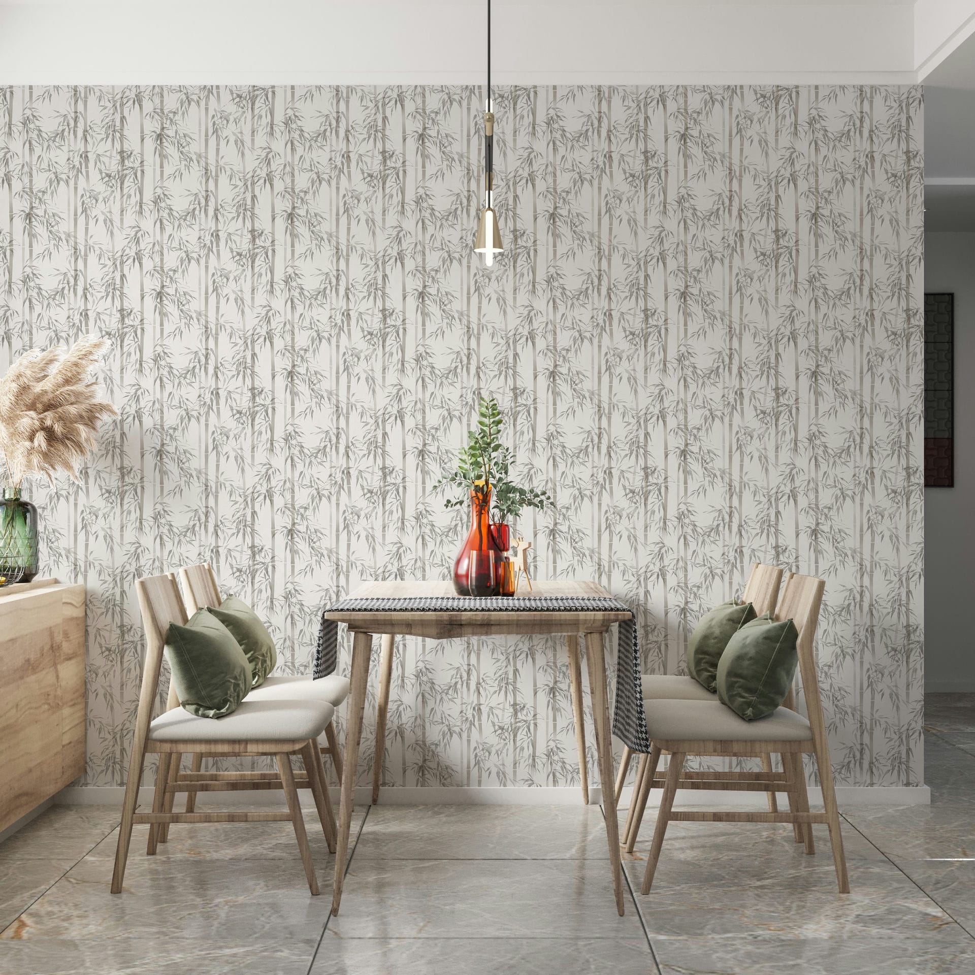 Marburg Novamur Mona 81671 Dining nook with a wood table and chairs in front of wallpaper patterned with vertical bamboo stalks and leaves. A pendant light hangs above, glass vases with greenery sit on the table, and a sideboard holds a vase with pampas grass.