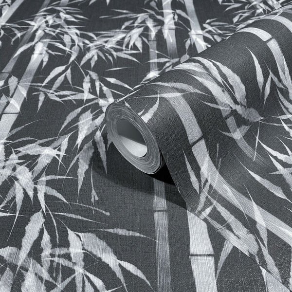 Marburg Novamur Mona 81672 Close-up of a wallpaper roll on matching unrolled paper featuring a black and white bamboo pattern with stalks and leaves.