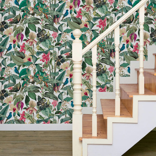 Marburg Novamur Mona 81686 Botanical wallpaper with green leaves, pink and cream flowers, and small birds on a light background behind a white staircase with wood treads.