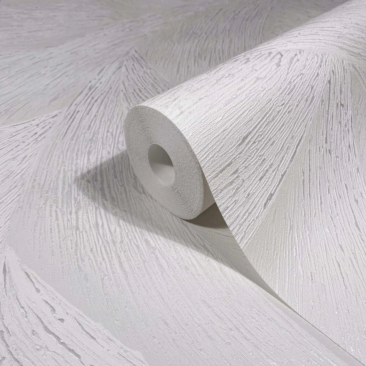 Marburg Ritus 35503 Close-up of a white textured wallpaper roll resting on matching unrolled wallpaper, showing a raised linear pattern with a subtle sheen.