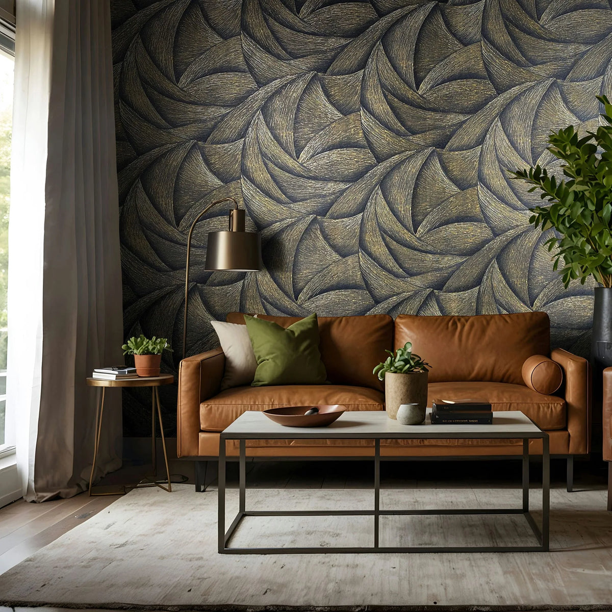 Marburg Ritus 35506 Living room with a caramel leather sofa in front of a bold black-and-gold swirling pattern wallpaper, with a coffee table, floor lamp, plants, and a window with curtains.