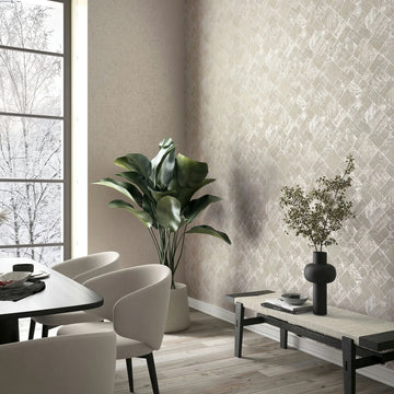 Marburg Ritus 35509 Room scene showing a dining corner with beige crisscross-patterned wallpaper on the right wall, light upholstered chairs around a table, a tall potted plant in the corner, and a low bench holding a black vase with branches beside a large window.