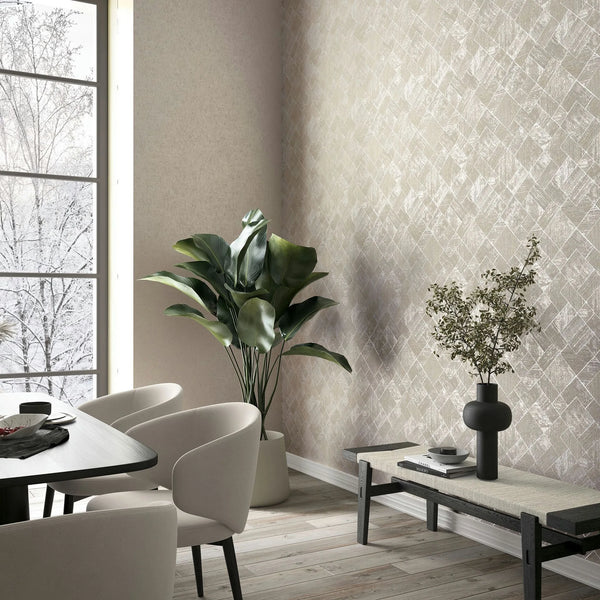 Marburg Ritus 35509 Room scene showing a dining corner with beige crisscross-patterned wallpaper on the right wall, light upholstered chairs around a table, a tall potted plant in the corner, and a low bench holding a black vase with branches beside a large window.