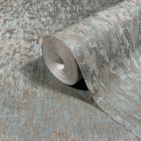 Marburg Ritus 35526 Wallpaper roll resting on an unrolled sheet showing an abstract textured blue and copper pattern.