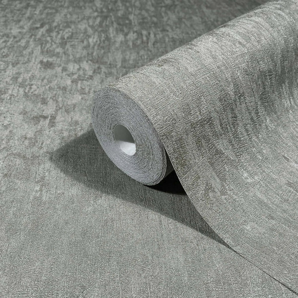 Marburg Ritus 35528 A gray textured wallpaper roll partially unrolled on a matching surface, showing a subtle irregular linear pattern.