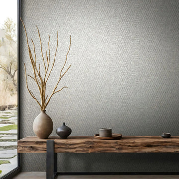 Marburg Ritus 35538 Gray geometric lattice wallpaper behind a wood console with ceramic vases and branches next to a large window.