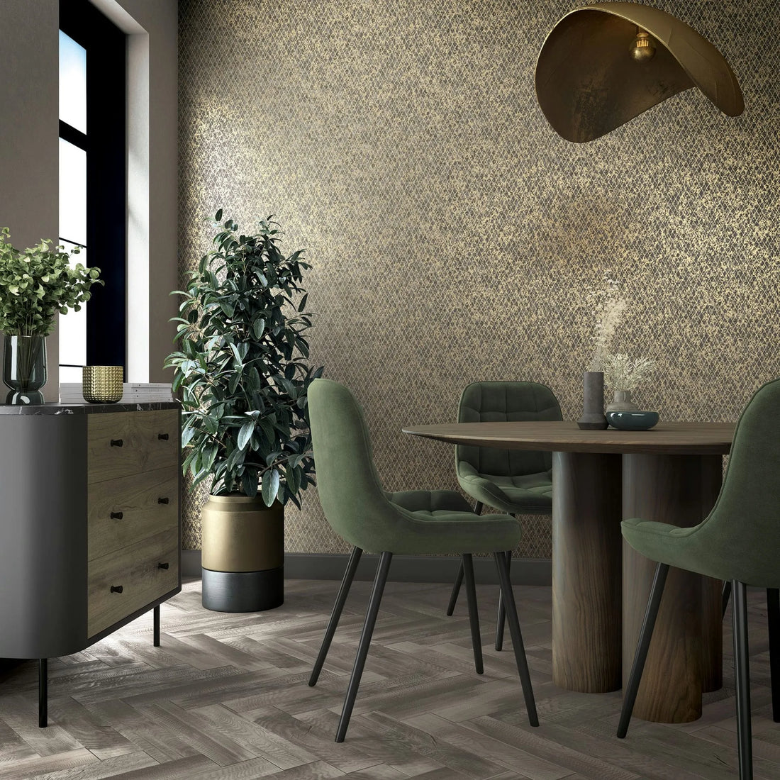 Marburg Ritus 35540 Gold and black small-scale geometric wallpaper on a dining room feature wall, shown with a round wood table, green upholstered chairs, a sideboard, a potted plant, a window, and a sculptural pendant light.