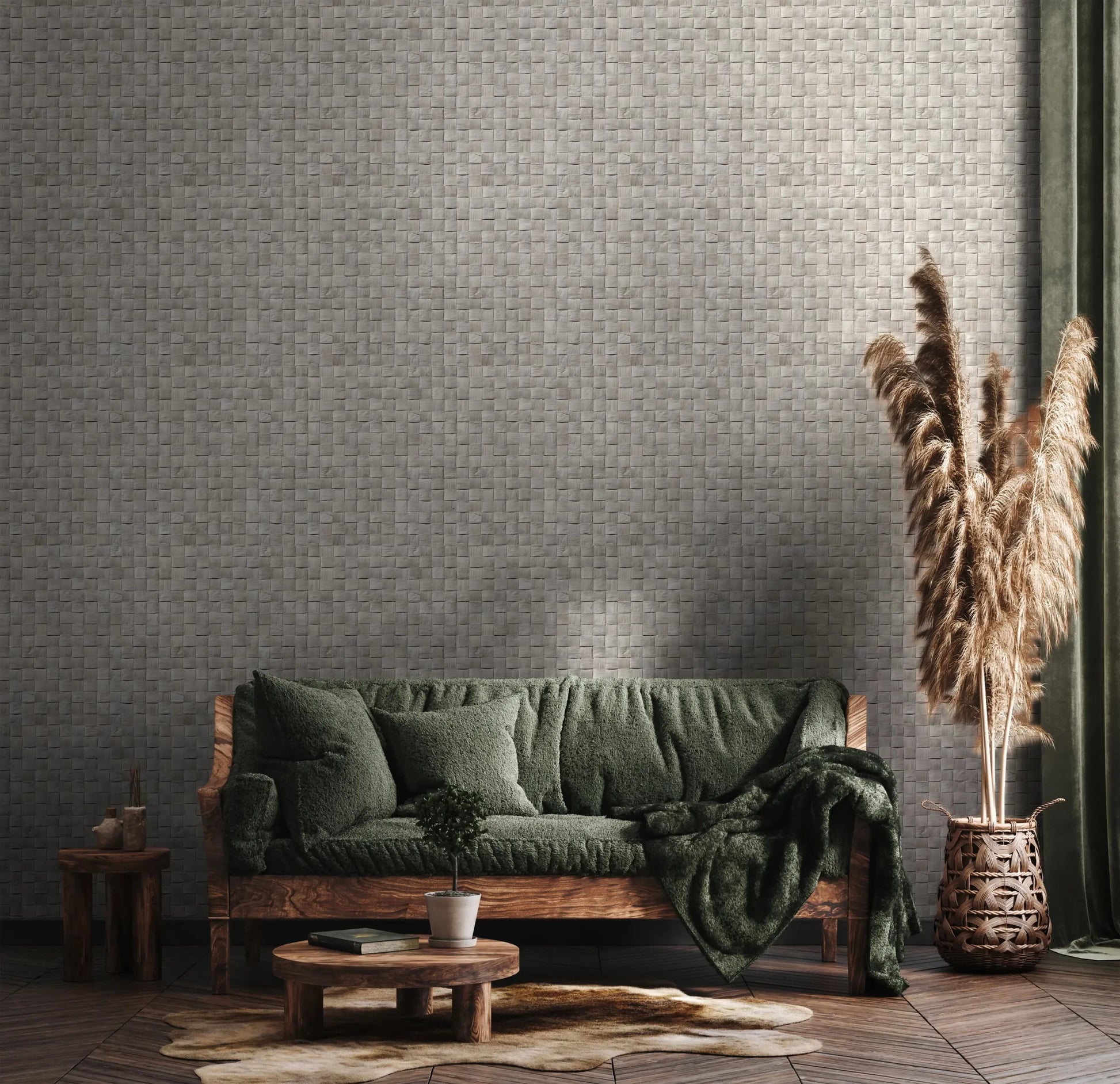 Marburg Struktura 45741 Gray woven basketweave wallpaper behind a living room scene with a wooden sofa dressed in green cushions and throw, round wooden tables with a small potted plant and book, an irregular light rug, a green curtain, and pampas grass in a woven floor basket.