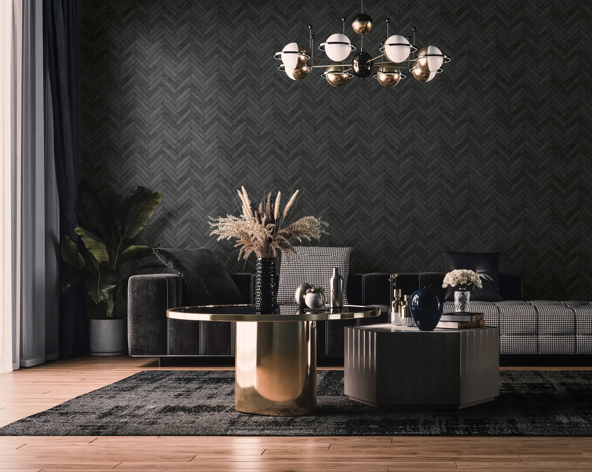 Marburg Struktura 45761 Dark herringbone-pattern wallpaper in anthracite on a living room feature wall, shown with a sofa, two coffee tables, a globe chandelier, curtains, a plant, and a dark rug.