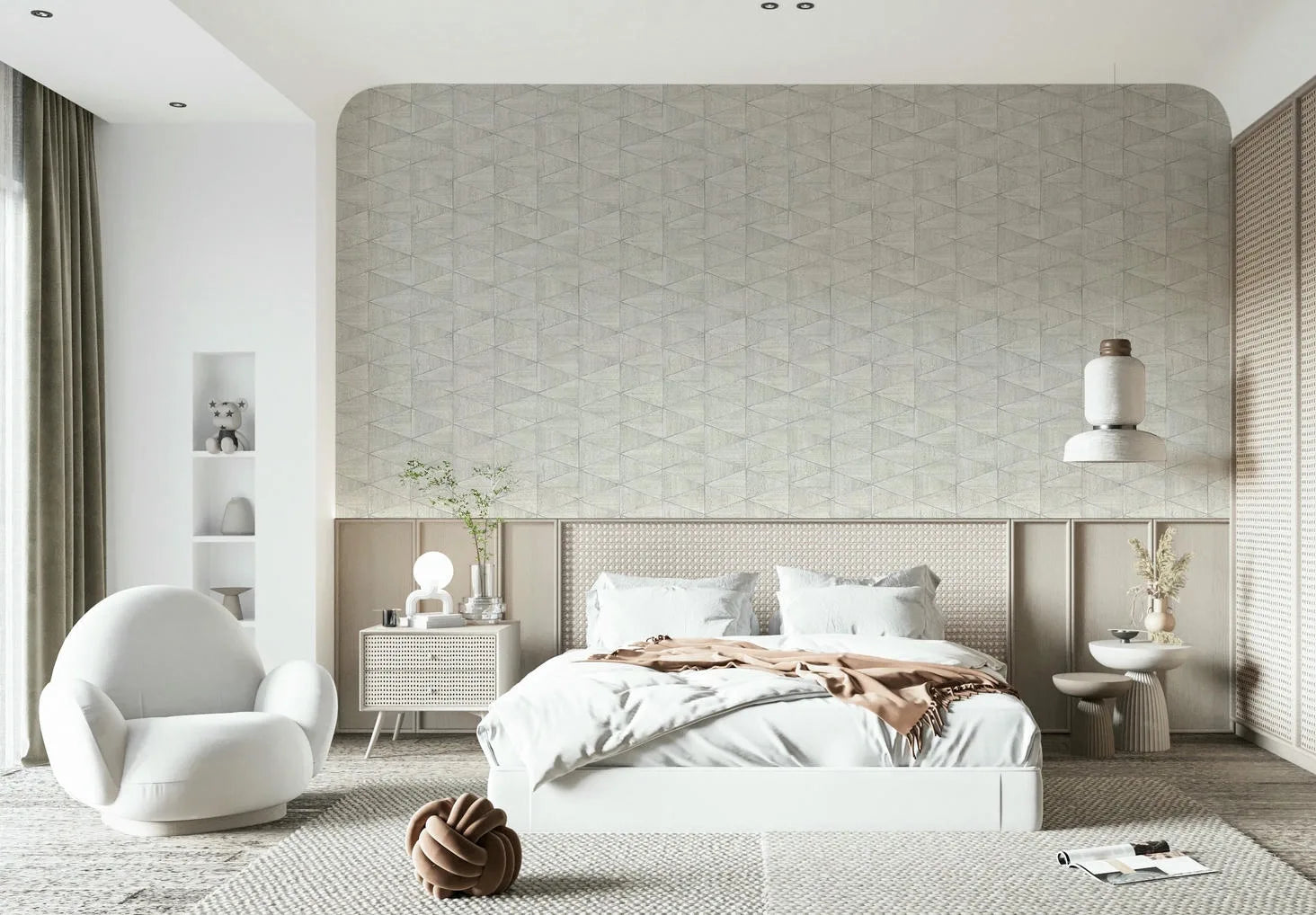 Marburg Travertino 33357 Bedroom scene with a beige‑gray geometric triangle wallpaper on an arched feature wall behind a white bed, accompanied by nightstands, a pendant light, and a rounded armchair.