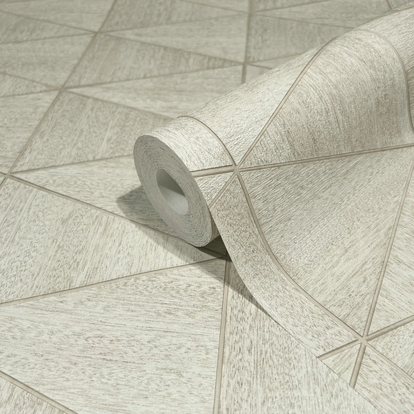 Marburg Travertino 33358 A wallpaper roll resting on matching wallpaper showing a light beige geometric pattern of intersecting lines with a subtle woodgrain texture.