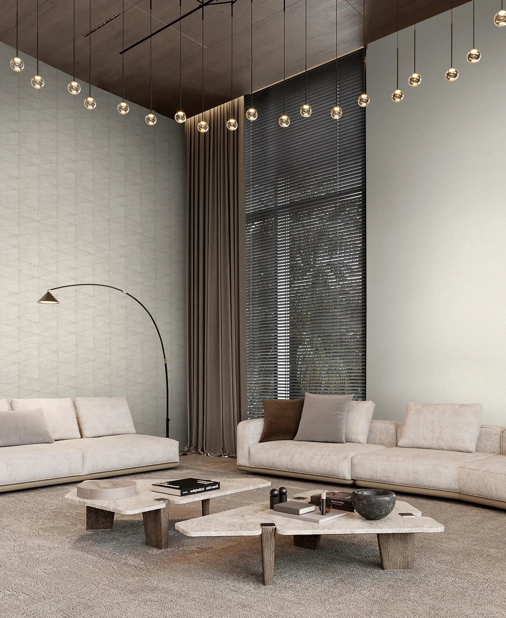 Marburg Travertino 33358 Modern living room with light beige geometric wallpaper on the left wall and a coordinating plain beige wall, featuring two sofas, two low coffee tables, long curtains with window blinds, a floor lamp, and a row of globe pendant lights.