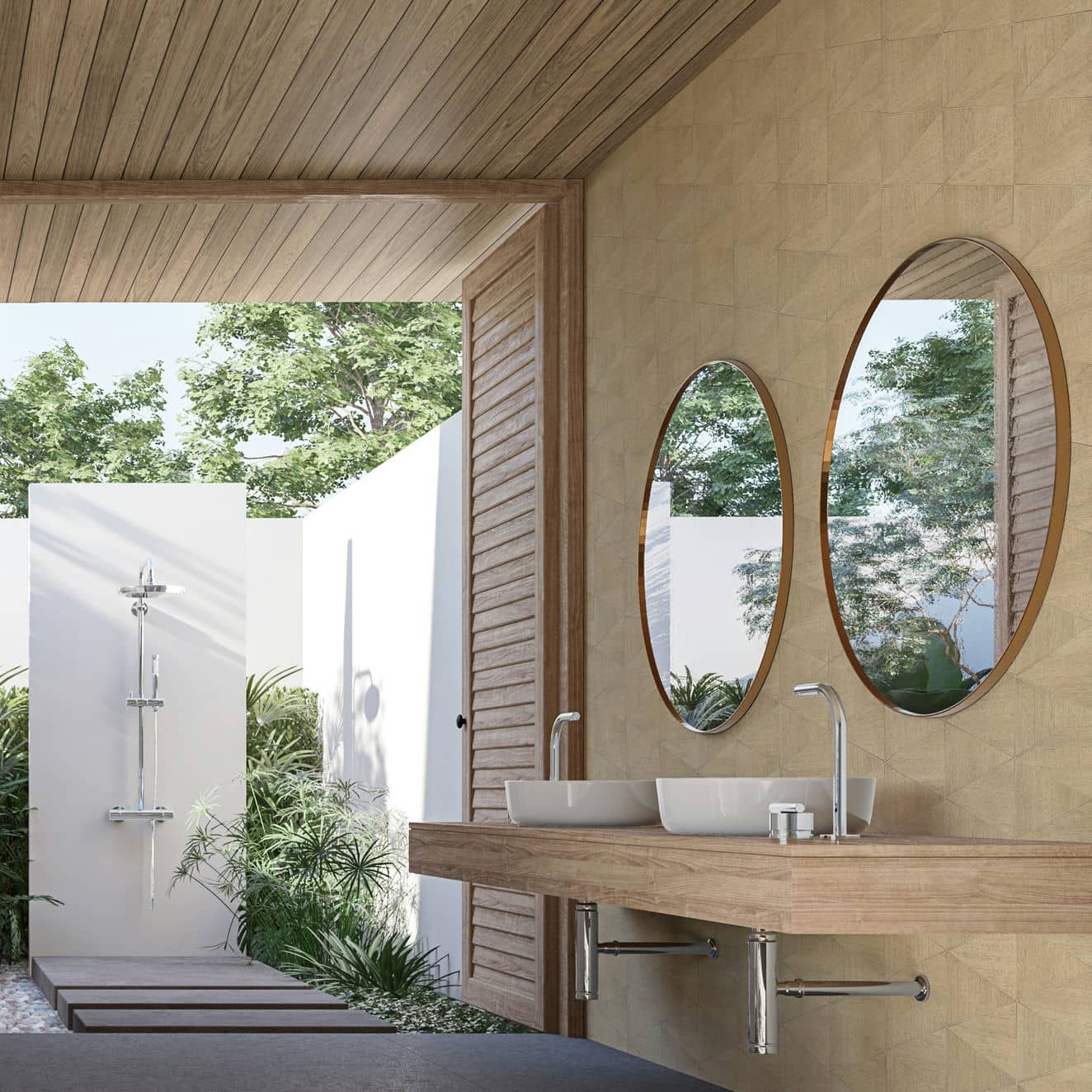 Marburg Travertino 33359 Beige geometric patterned wallpaper on a feature wall behind a floating wood vanity with two oval mirrors and double vessel sinks, in a bathroom that opens to greenery and an outdoor shower.