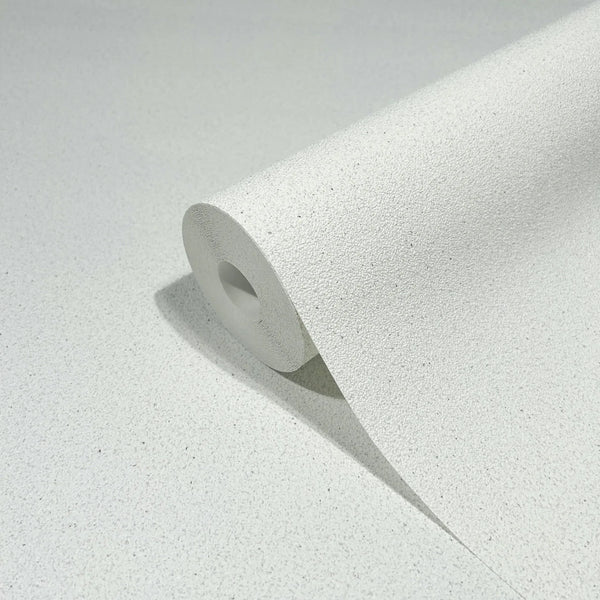 Marburg Travertino 33364 Close-up of a white speckled textured wallpaper roll on a matching unrolled sheet.