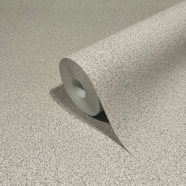 Marburg Travertino 33366 A single roll of light gray speckled wallpaper partially unrolled on a matching surface, showing the fine grain pattern.