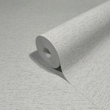 Marburg Travertino 33369 Close-up of a gray textured wallpaper roll resting on a matching unrolled sheet, showing a fine horizontal striated texture.