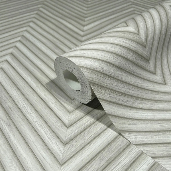 Marburg Travertino 33374 A wallpaper roll resting on an unrolled sheet showing a gray chevron-style pattern of diagonal ridged lines.