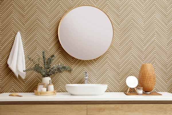 Marburg Travertino 33376 Beige chevron (herringbone) wallpaper made of narrow alternating lines with soft shading for a tonal wallpaper on a bathroom feature wall.