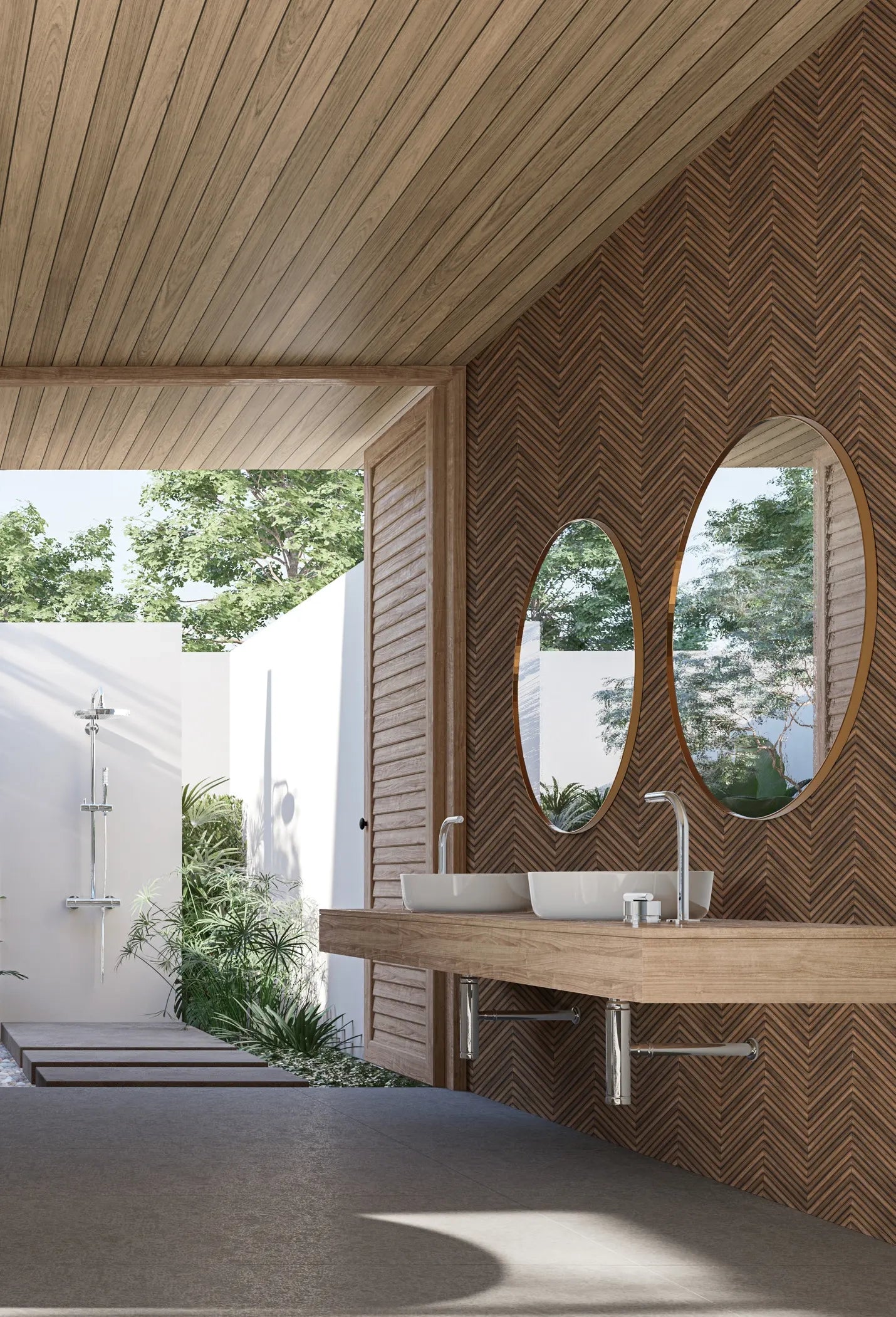 Marburg Travertino 33378 Brown chevron wallpaper behind a floating vanity with two oval mirrors and vessel sinks in a bright bathroom, with greenery and an outdoor shower visible.