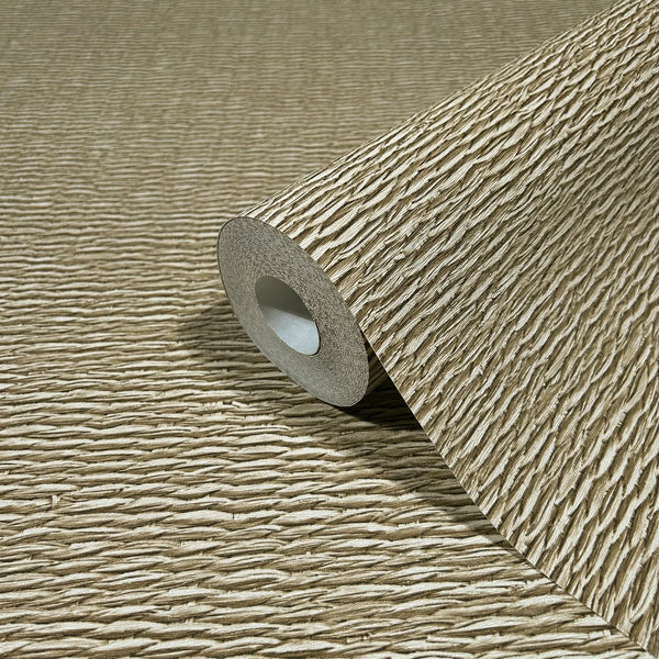 Marburg Travertino 33384 Close-up of a beige wallpaper roll with horizontal ridged texture, resting on the same unrolled wallpaper.
