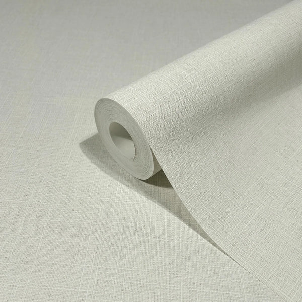 Marburg Travertino 33389 Close-up of a light beige crosshatch textured wallpaper with a partially unrolled roll resting on the same pattern.