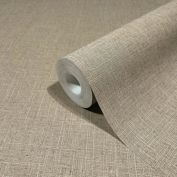 Marburg Travertino 33393 Wallpaper roll with a beige crosshatch, fabric-like texture, partially unrolled on a matching surface.