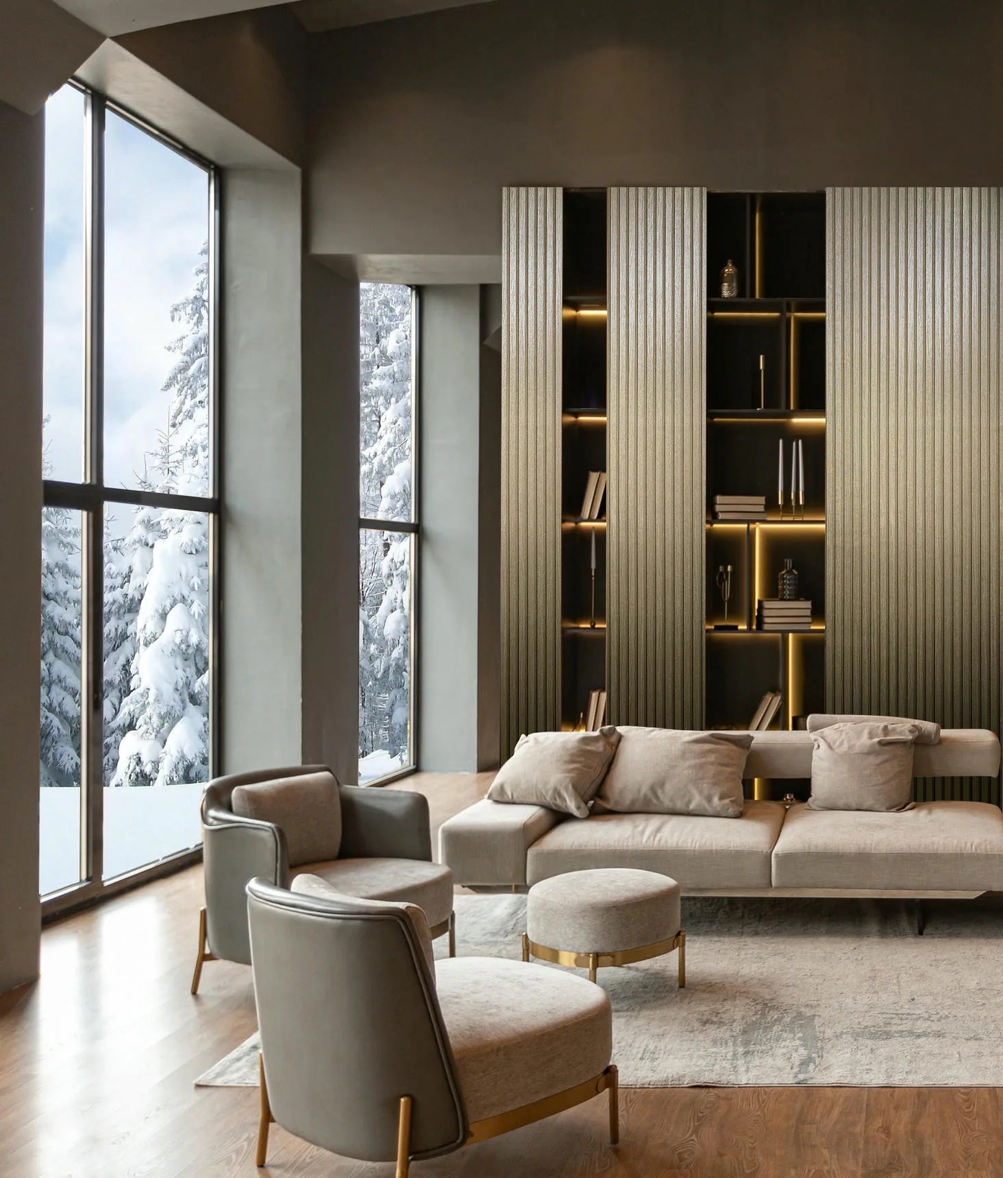 Marburg Travertino 33396 Living room scene showing vertical ribbed gold wallpaper on a wall with open shelving, next to tall windows with snowy trees outside, with a sofa, armchairs, ottomans, and a rug in view.