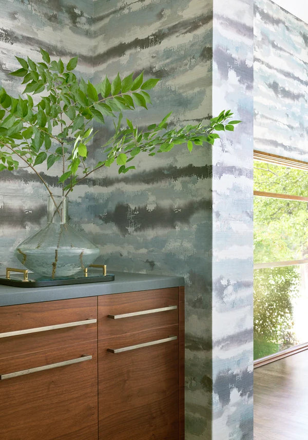 Thibaut Silver Lining wallpaper with Abaca on Foil styled beside a decorative vase detail.