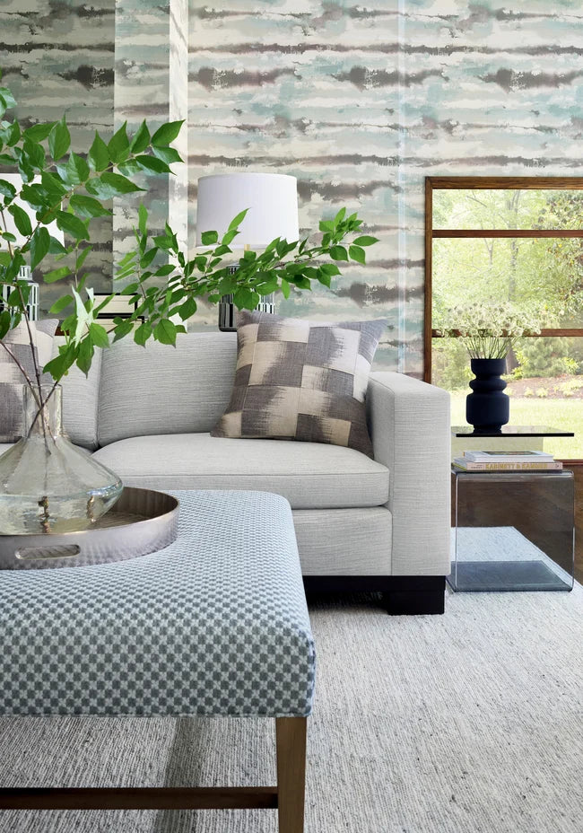 Thibaut Silver Lining wallpaper with Abaca on Foil styled beside a decorative vase detail.