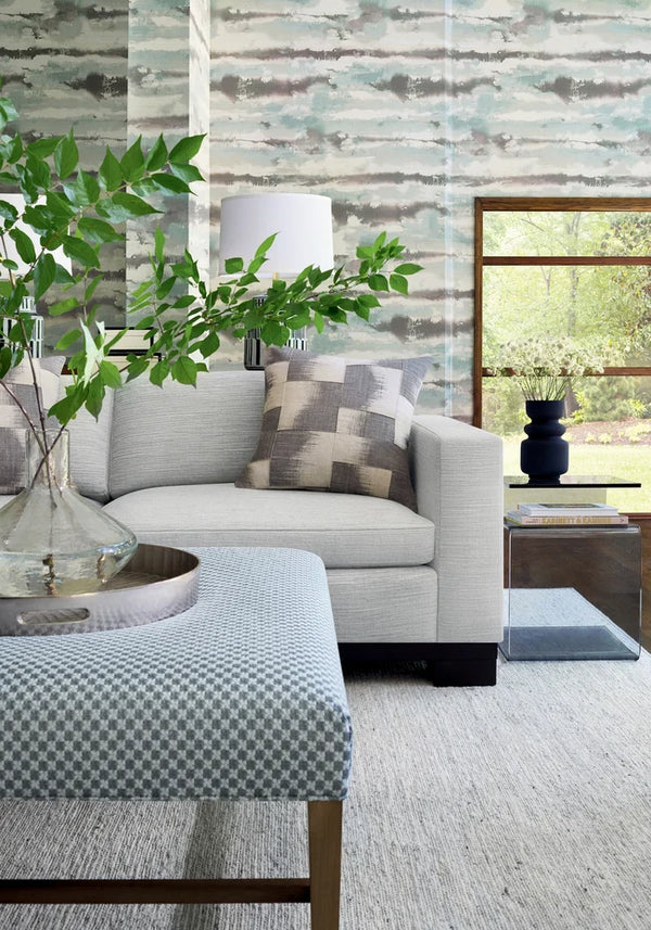 Thibaut Silver Lining wallpaper with Abaca on Foil styled beside a decorative vase detail.