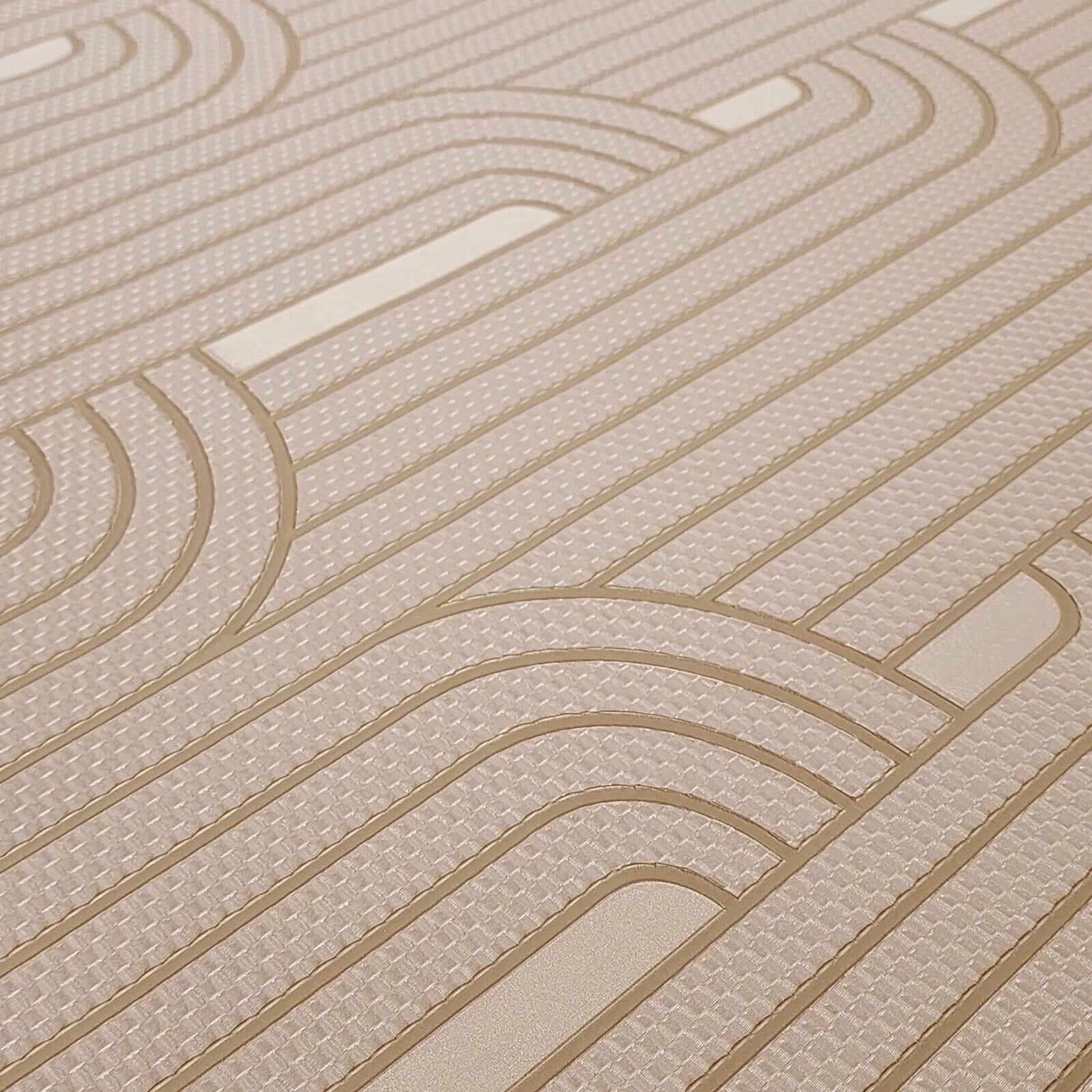Close-up of a textured beige wallpaper with wavy lines