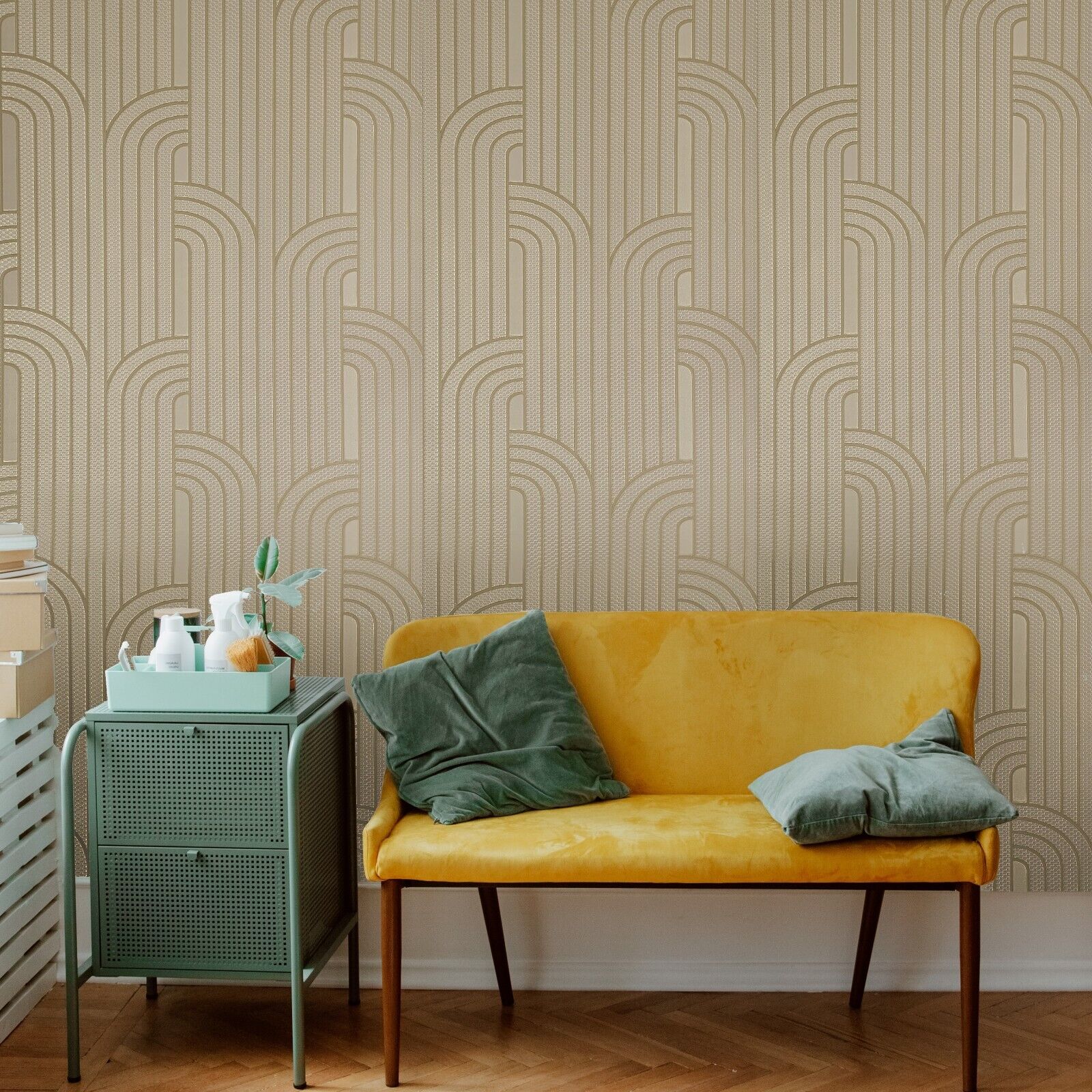 Yellow sofa with green cushions against a patterned wall, next to a green side table.